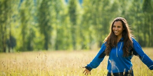 Woman smiling in a field